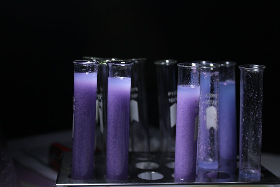 Close-up of purple liquid in test tubes against a black background, ideal for scientific and educational content.